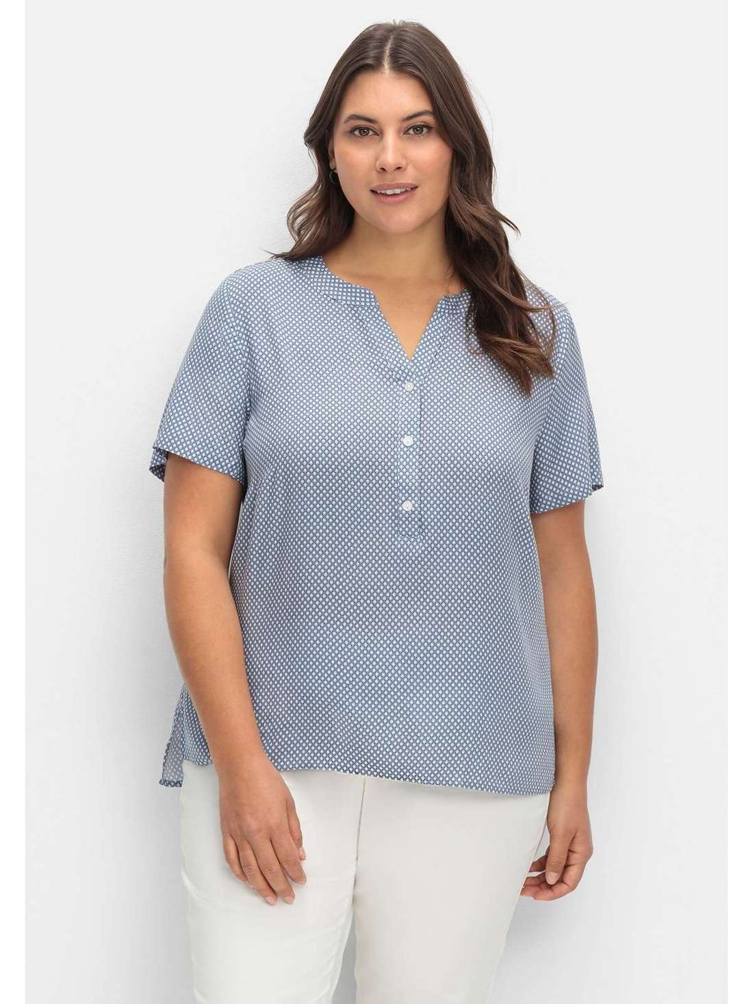 Туника с короткими рукавами и удлиненной спинкой. Große Größen