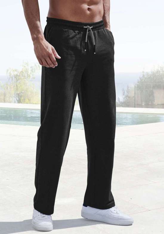 Спортивные брюки меланжевого цвета из смесового хлопка. weit geschnitten