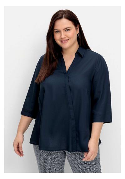 Блузка-рубашка с запахом и планкой на потайных пуговицах.