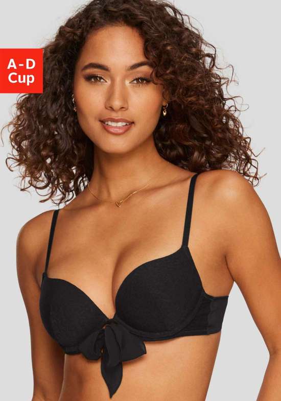 Бюстгальтер пуш-ап на косточках и женственным бантом посередине спереди.