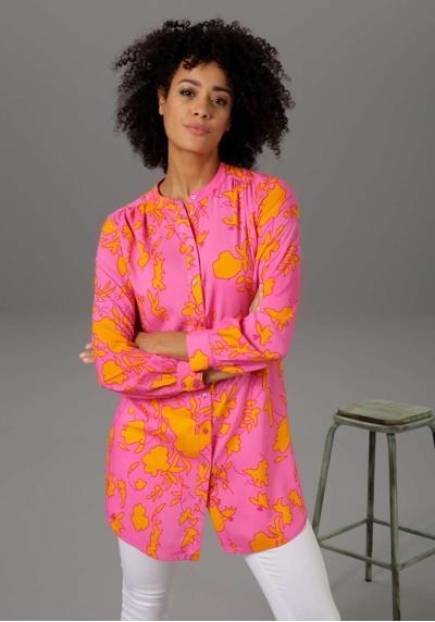 Длинная блузка с графичным цветочным принтом в ультрасовременных цветовых сочетаниях