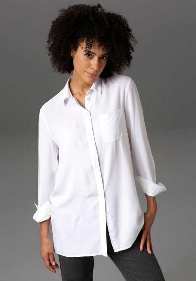 Длинная блузка с полосками «ANISTON» на спине.