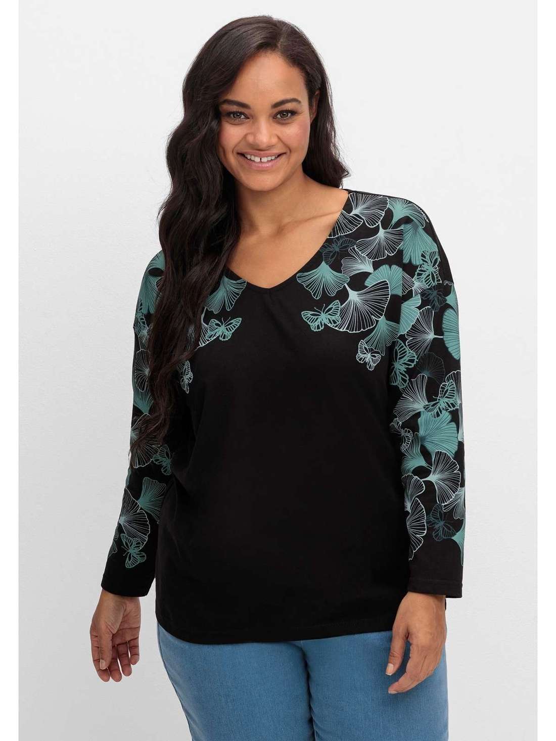 Рубашка с длинными рукавами, V-образным вырезом и принтом в виде листьев. Große Größen