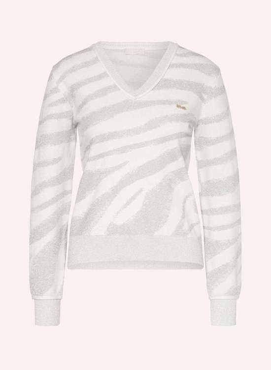 Свитер из блестящей пряжи