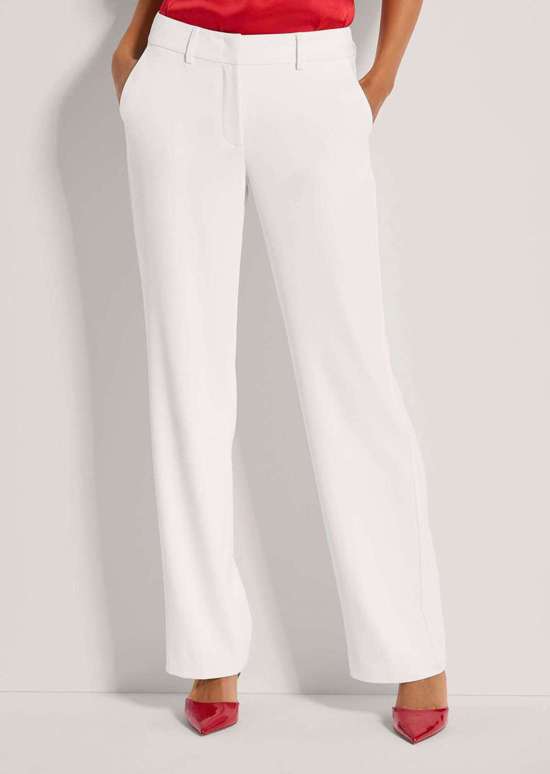 Широкие брюки стрейч с запрессованными складками.