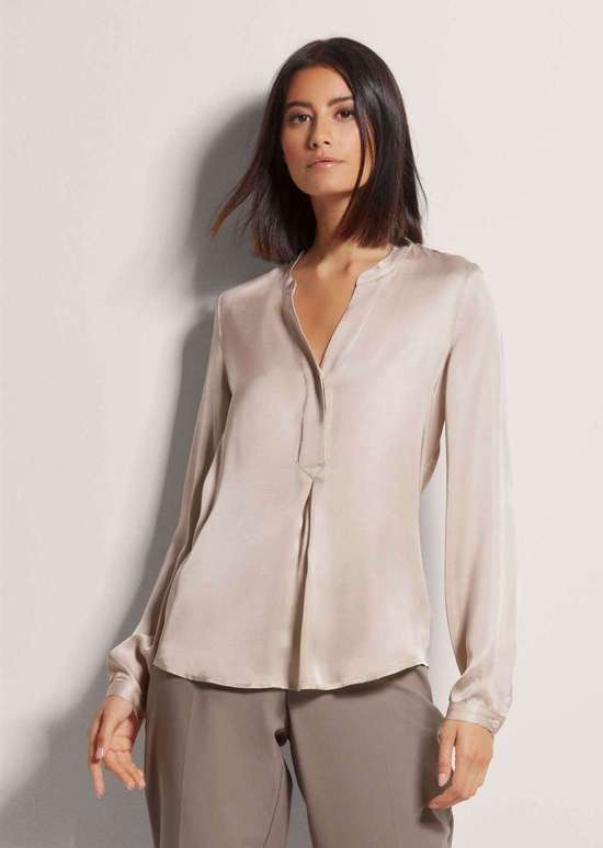 Туника модного А-силуэта.