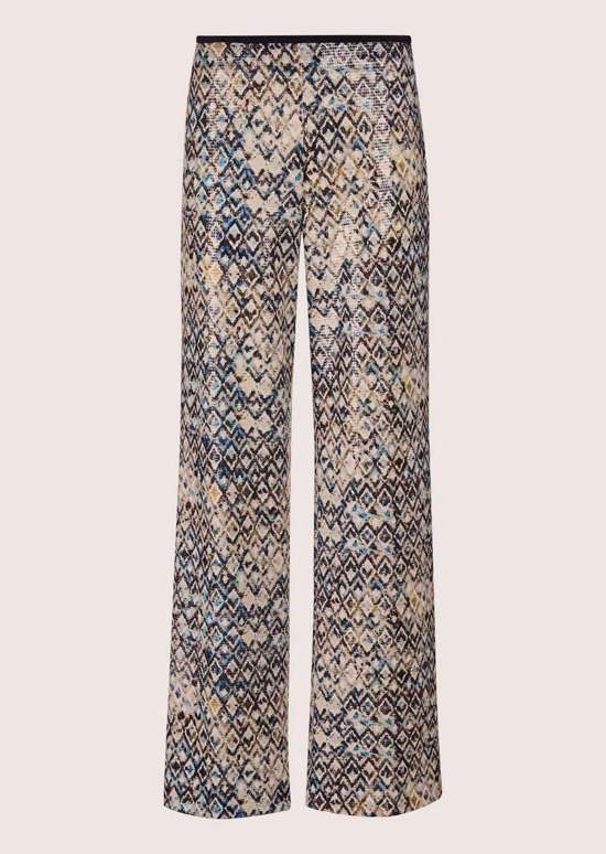 Широкие брюки с прижатыми складками и пайетками.