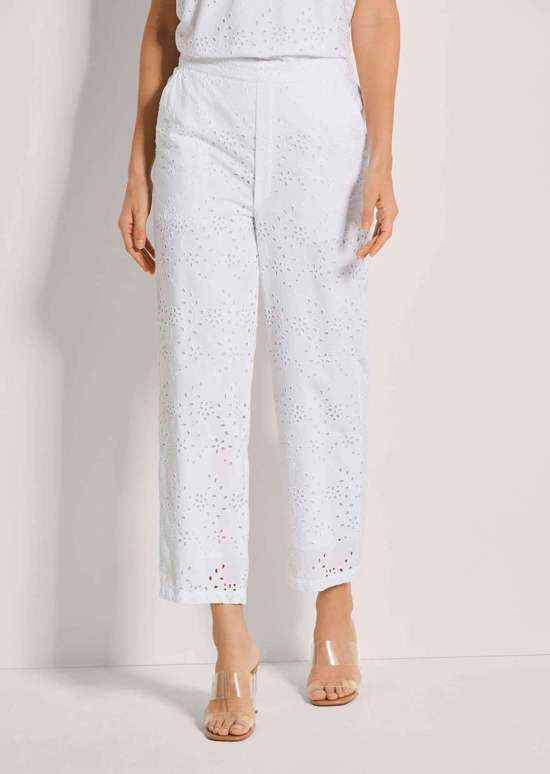 Брюки без застежки с вышивкой на люверсах