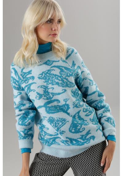 Вязаный свитер с жаккардовым узором в гармоничных оттенках синего цвета.