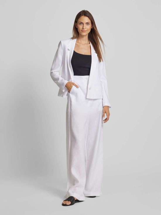 Расклешенные тканевые брюки простого дизайна