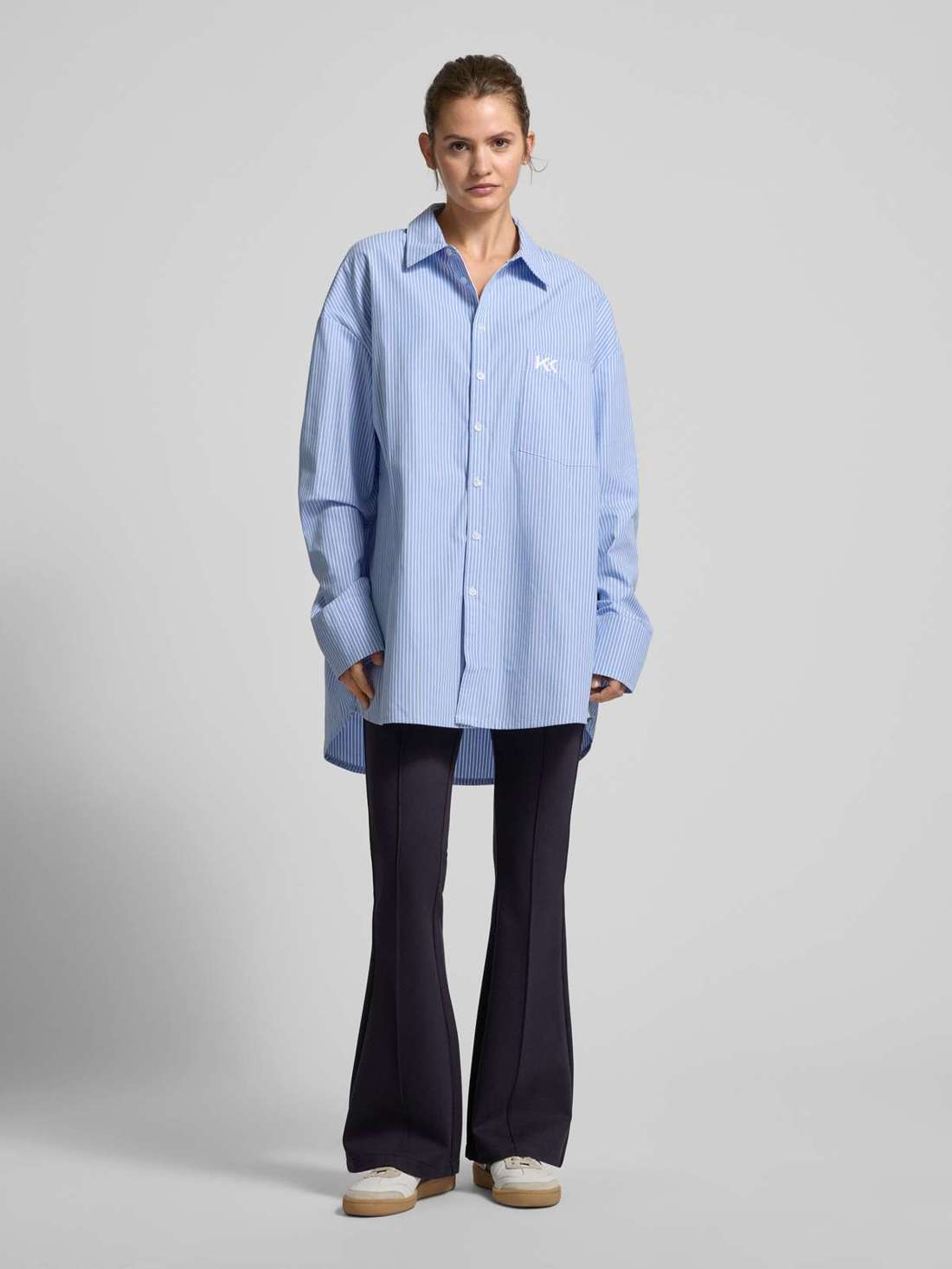 Расклешенные брюки с французскими боковыми карманами