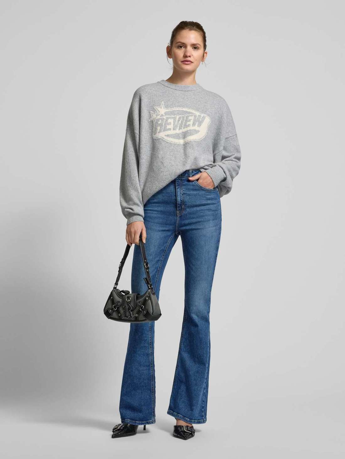 Расклешенные джинсы с пятью карманами