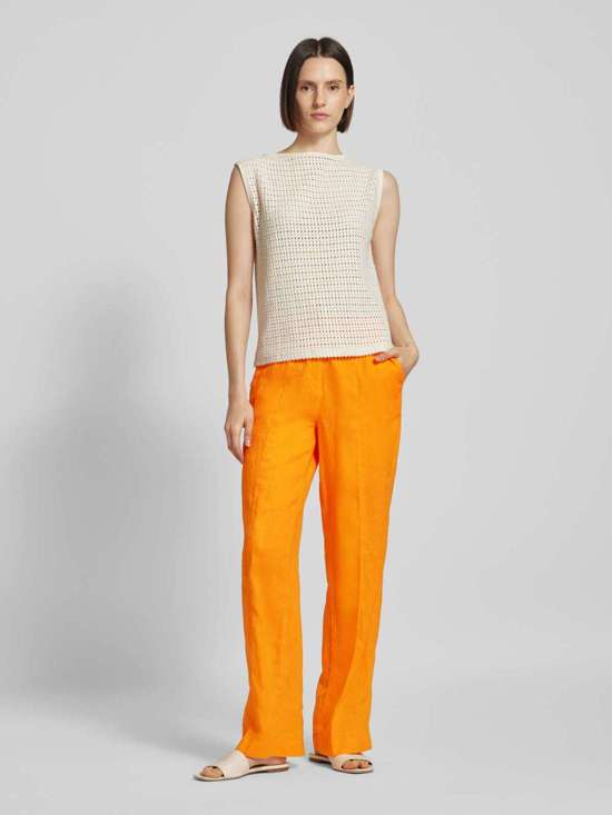 Широкие льняные брюки с фиксированными складками